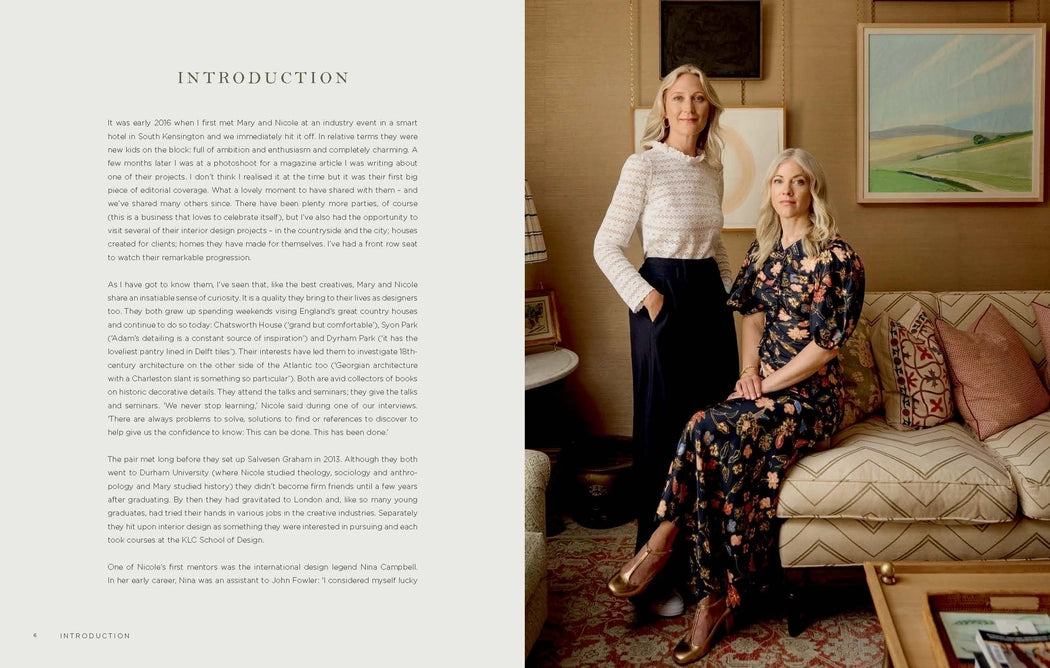 Two women in a living room with text on the left side