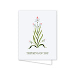 Greeting card with floral design and 'Thinking of You' text on a white background