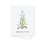 Greeting card with floral design and 'Thinking of You' text on a white background