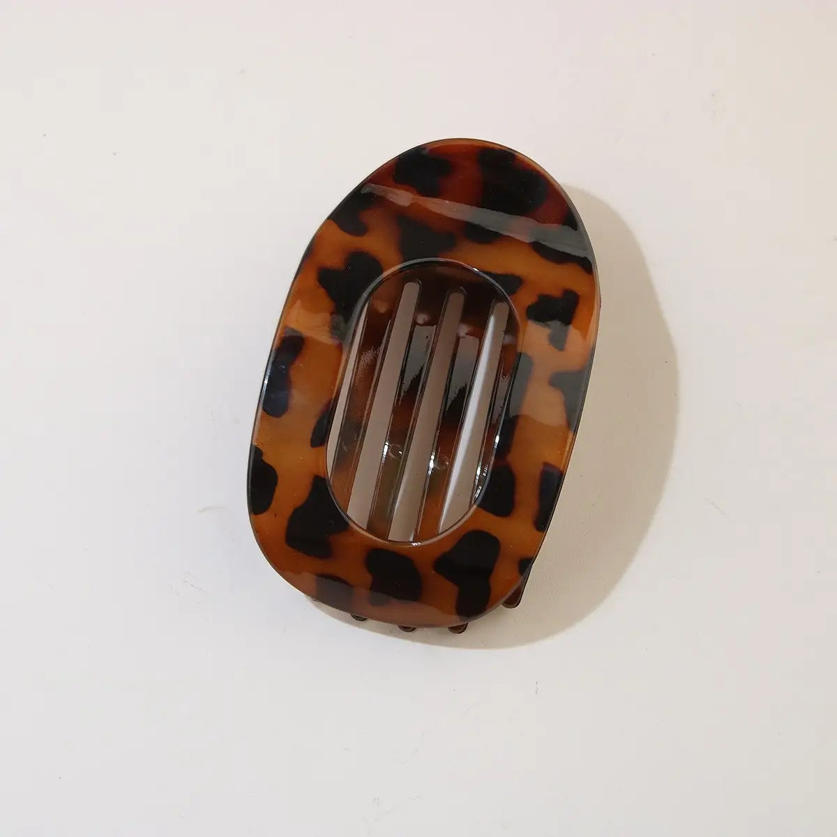 Tortoiseshell patterned hair clip on a white background