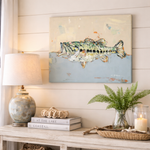 Decorative wall art of a fish on a wooden shelf with books, a lamp, and a candle.