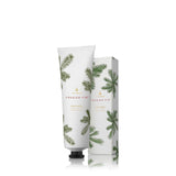 Hand cream with packaging featuring Frasier Fir tree design on a white background