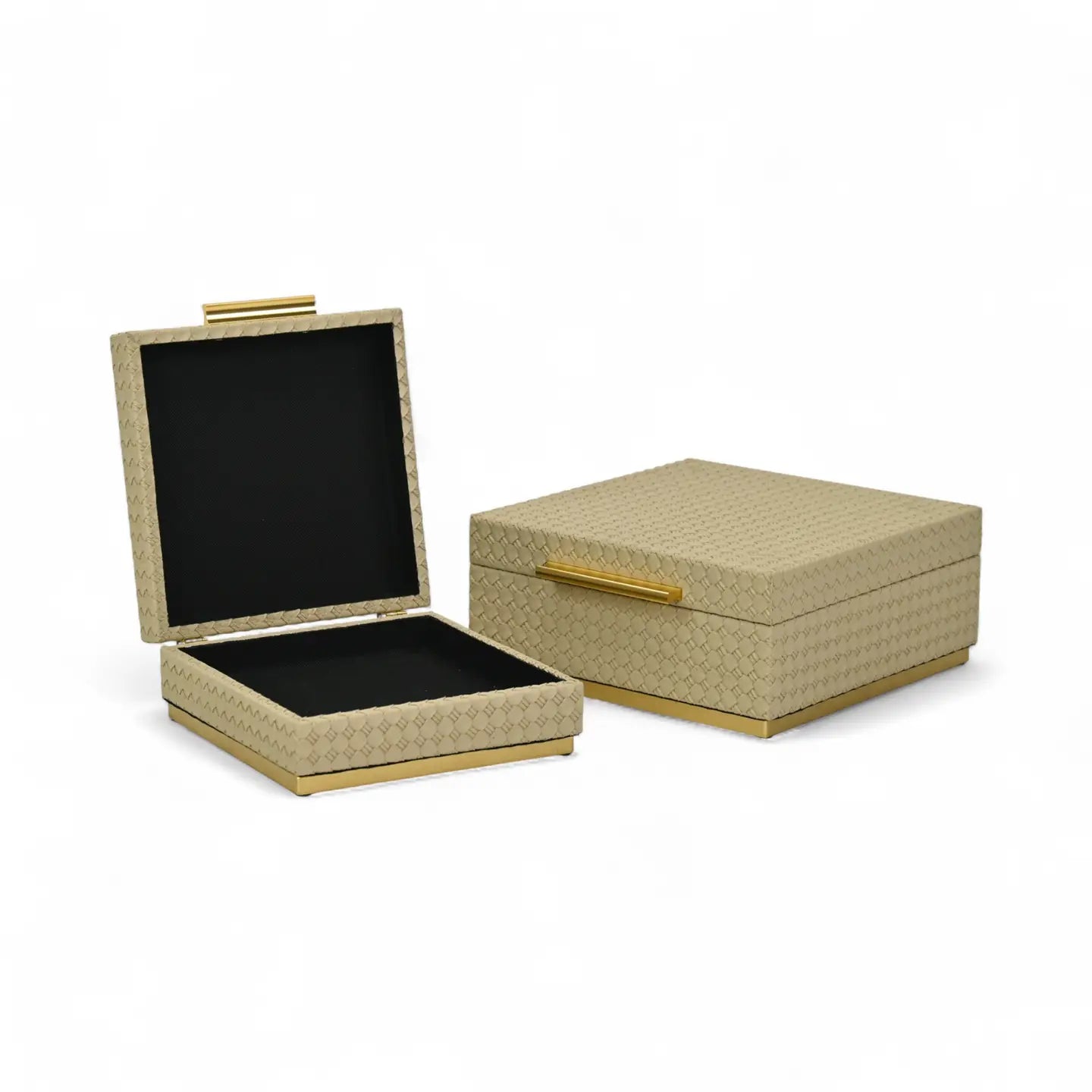 Beige jewelry box with gold accents on a white background