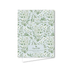 Notebook with floral pattern on a light blue background