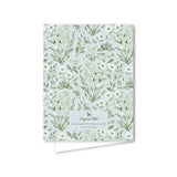 Notebook with floral pattern on a light blue background