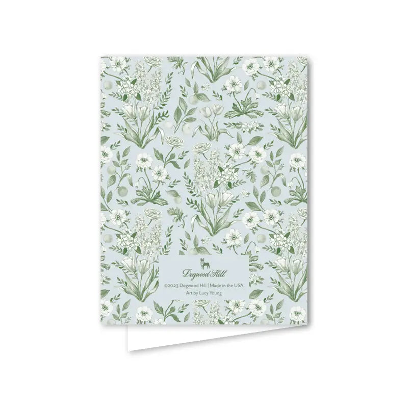 Notebook with floral pattern on a light blue background