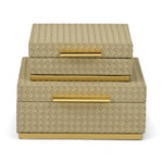 Set of two decorative boxes with woven pattern and gold accents on a white background