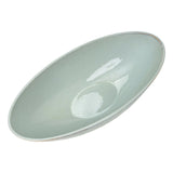 glazed ceramic wide flared  pedestal bowl with ribbed textured base on white background