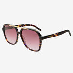 Sunglasses with tortoiseshell frame and pink gradient lenses on a white background