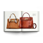 Open book displaying two brown handbags on a white background