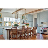 Modern kitchen with wooden island and chairs, light blue cabinets, and decorative elements.