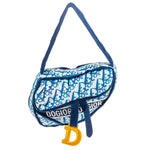 Plush navy Dogior Saddle Handbag dog toy with signature monogram design, gold “D” charm, and built-in squeaker.