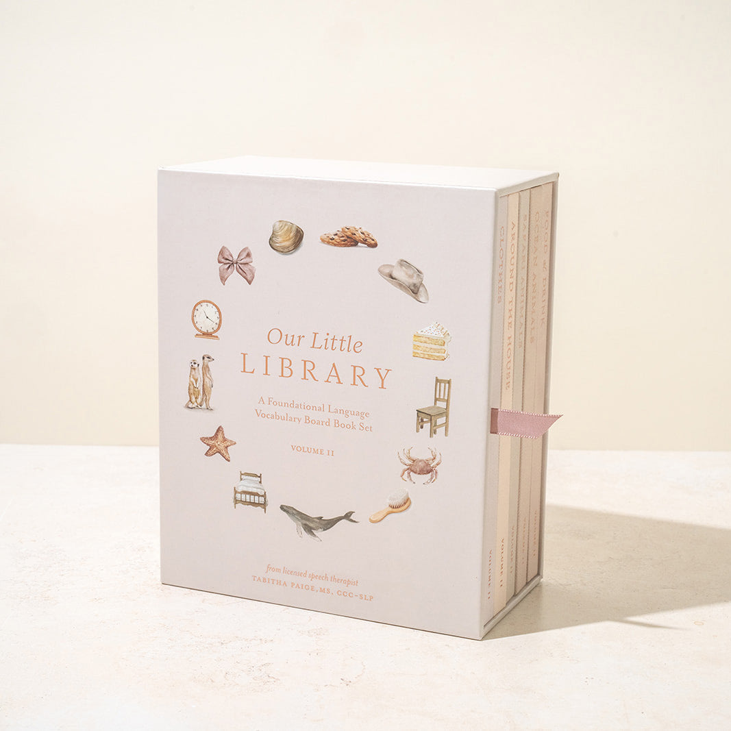 Book titled 'Our Little Library' with decorative illustrations on a white background