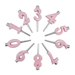 Pink number candles arranged in a circular pattern on a white background