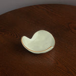 White ceramic dish on a wooden surface