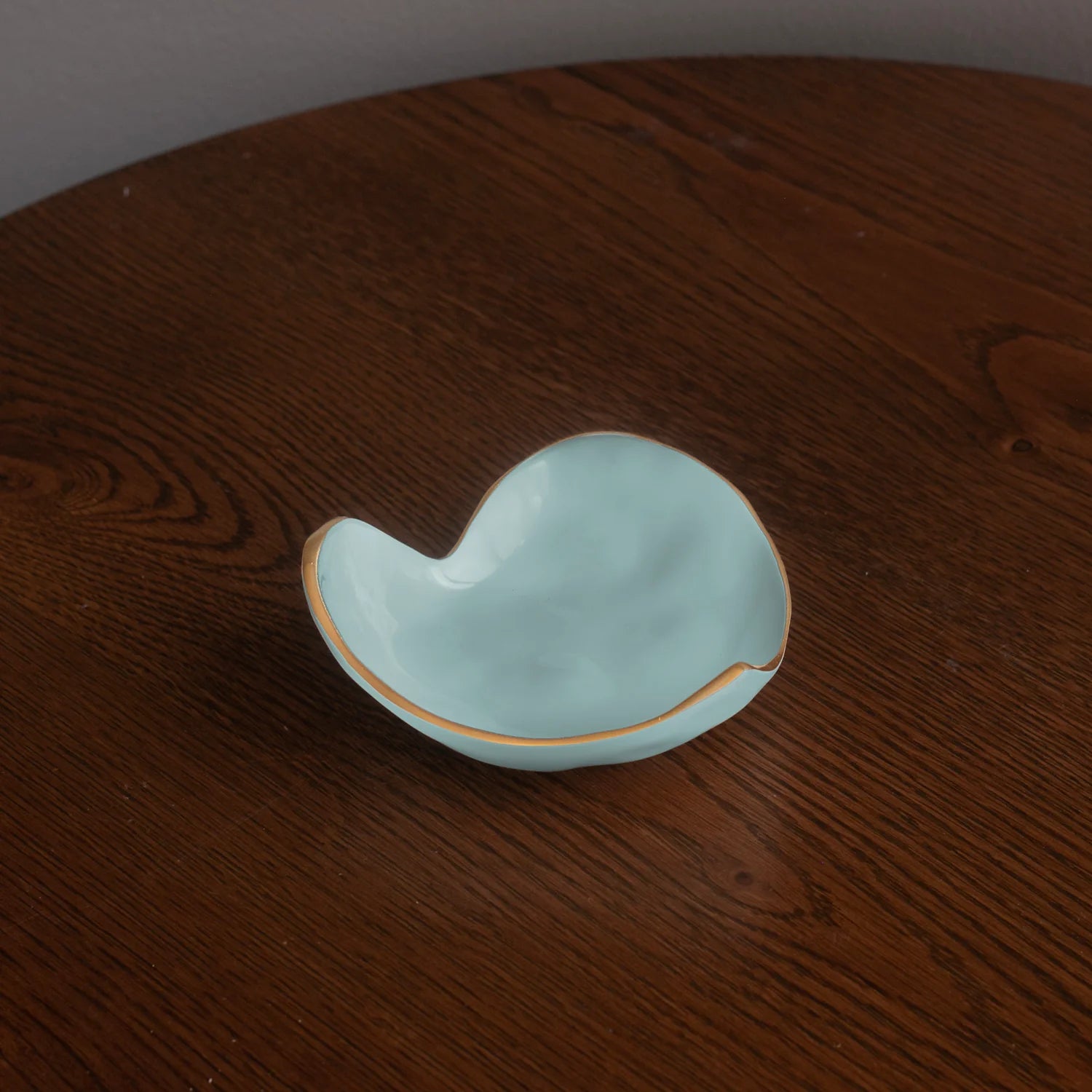 Light blue ceramic dish on a wooden surface