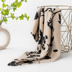 taupe fringe scarf with black floral printed design