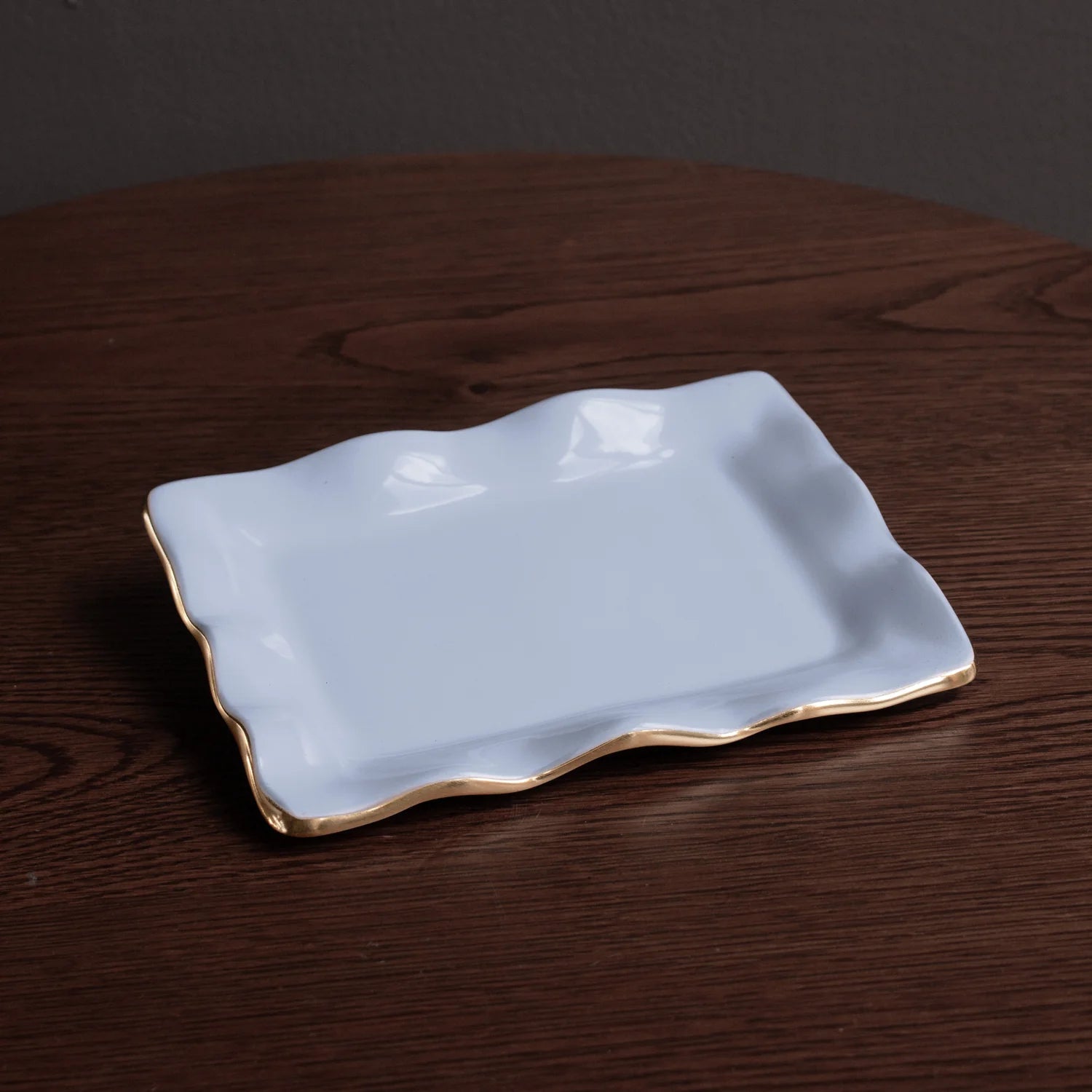 encanto vento small rectangular tray periwinkle on a wooden surface