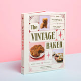 Book titled 'The Vintage Baker' on a pink background