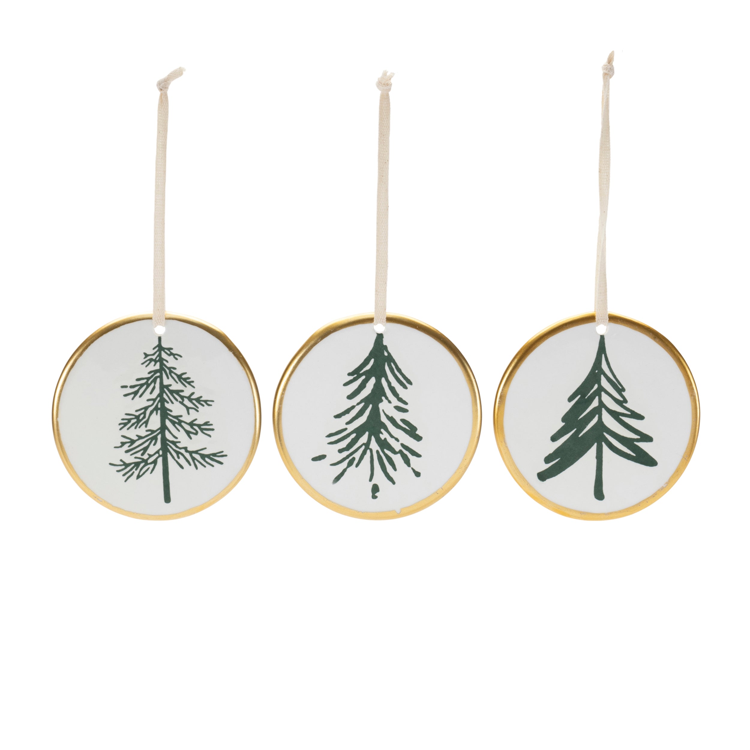 Three circular Christmas ornaments with green tree designs on a white background