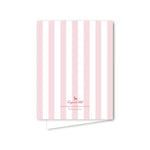 Notebook with pink and white vertical stripes on a white background