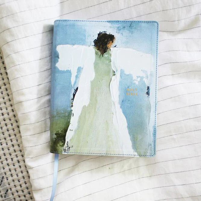Anne Neilson Bible with a cover featuring an artistic illustration of a woman in a dress on a textured fabric background.