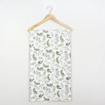 Floral patterned fabric on a hanger against a white background