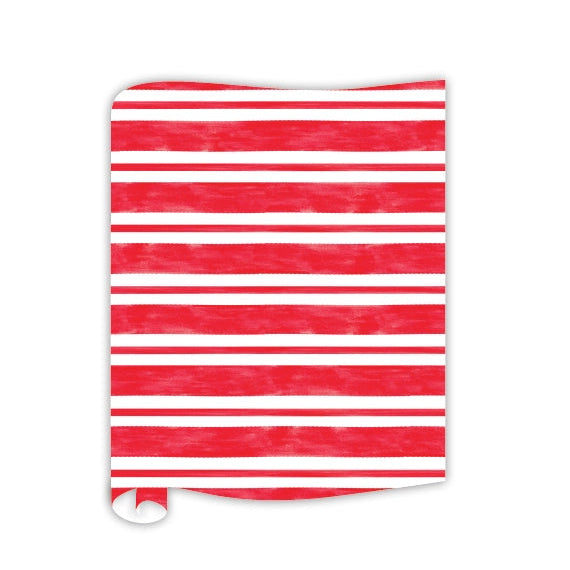 Red and white striped paper table runner on a white background