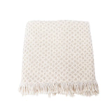Beige woven blanket with fringe on a white background