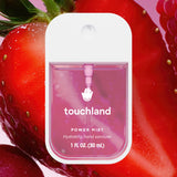 Touchland power mist hand sanitizer packaging on a strawberry background