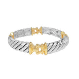 Two-tone silver and gold bracelet on a white background