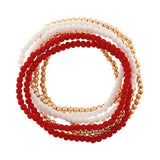 Set of red, white, and gold beaded bracelets on a white background