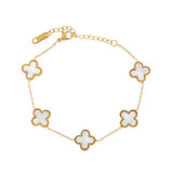 gold chain bracelet with five clover-shaped white enamel charms