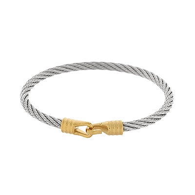 Silver cable bracelet with a gold clasp on a white background