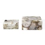 Two marble-like rectangular objects on a white background