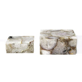 Two marble-like rectangular objects on a white background
