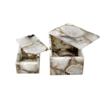 Marble-patterned jewelry box with a lid open on a white background
