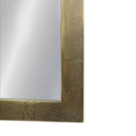 Close-up of a rectangular mirror with a textured gold frame on a white background