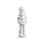 White ceramic nutcracker figurine on a white background