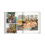 open book view showing costumes from a festival parade from the hardcover book "London. In Fashion" on a white background