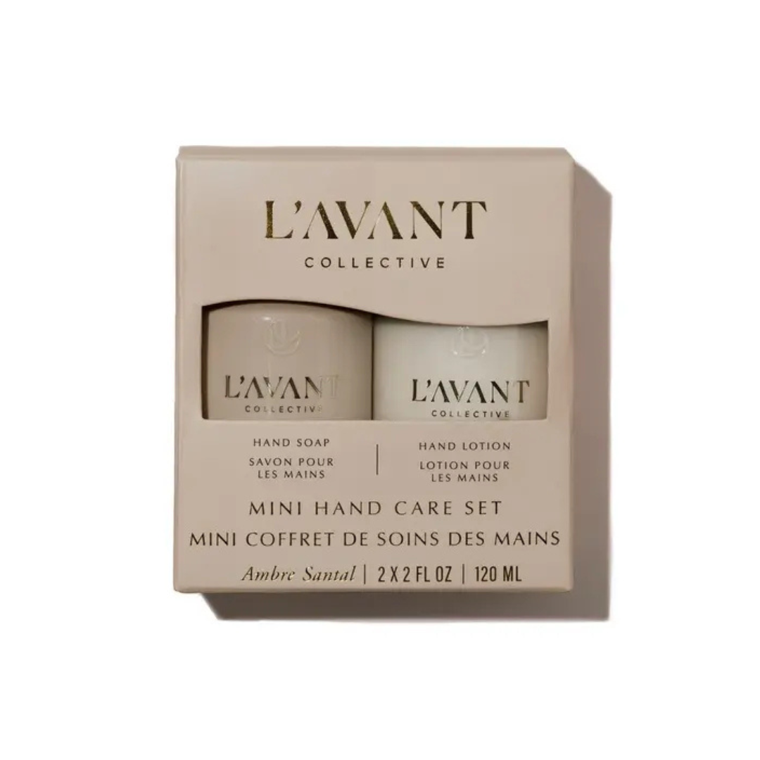 L'avant Collective Mini Hand Care Set in Ambre Santal, featuring a beige box containing a hand soap and a hand lotion bottle, shown on a white background.