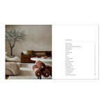 An open book showing a styled interior scene on the left and a contents page on the right, from hardcover book "WORLD'S BEST III"  on a white background