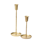 two thin gold candlesticks with low rim base, available in varying heights, on a white background