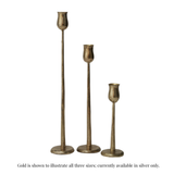 Three brass candlesticks of different heights with a textured metallic finish, arranged in a row against a plain white background.
