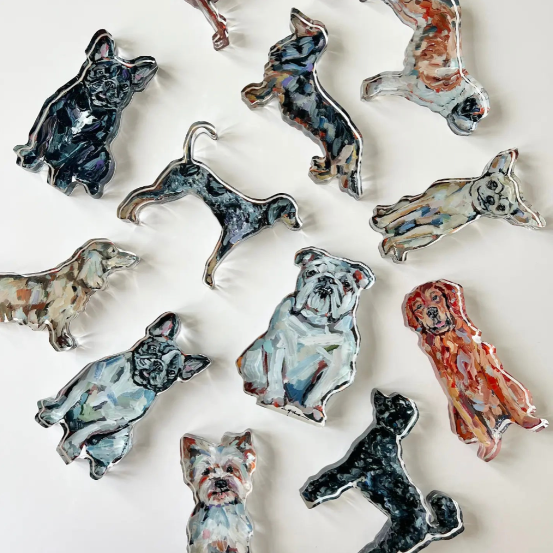 collection of acrylic dog figurines in various poses on a white background