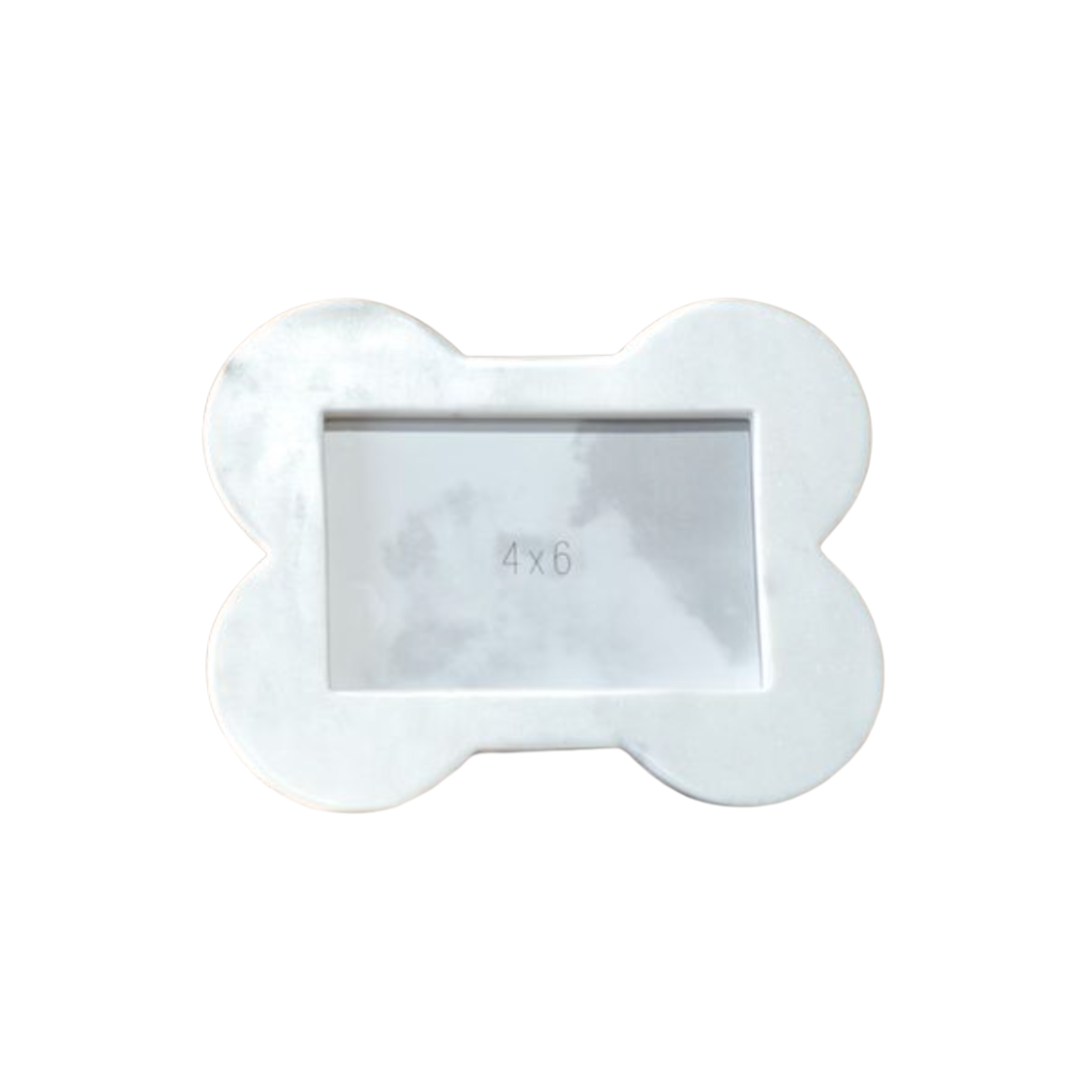 white marble picture frame in the shape of a dog bone on a white background