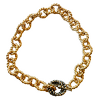 chunky twisted gold chain with a single silver accent