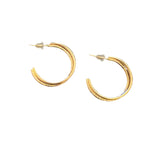 A pair of gold hoop earrings with a textured, hammered finish and push-back closures, displayed against a white background.