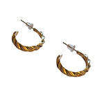 A pair of small gold-tone twisted hoop earrings with push-back closures, displayed on a white background.