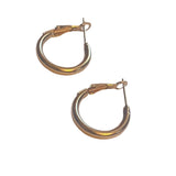 A pair of medium gold-tone hoop earrings with a smooth finish and hinged clasp closures, displayed on a white background.